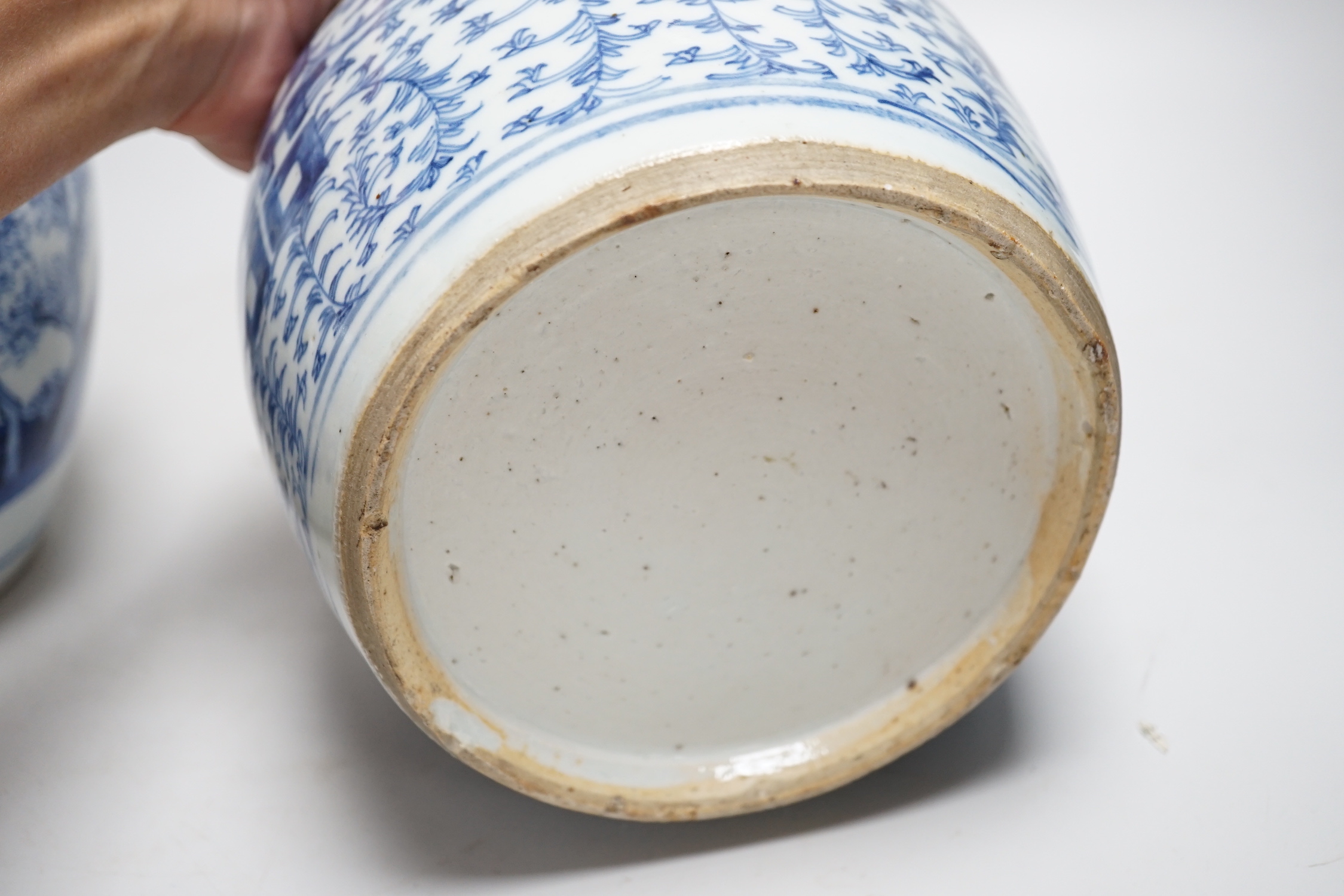 Two Chinese blue and white jars and a similar tea caddy